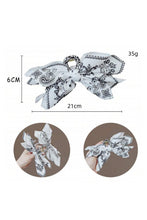 Load image into Gallery viewer, Black Paisley Floral Print Bow Knot Hair Clip - authentic country fashion from Working Bull
